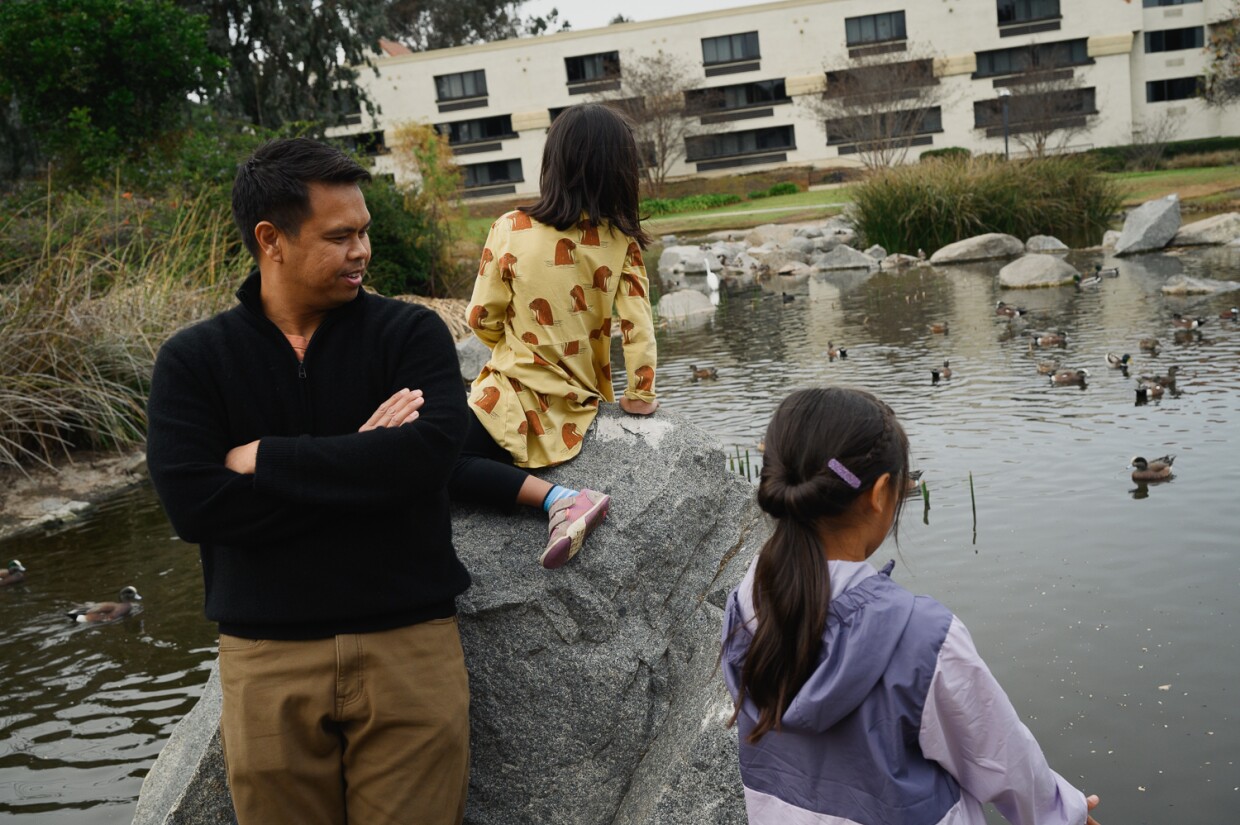 Photographs of Dennis Lim and his two daughters at Webb Park, where they go every week to feed the birds, near their home in north San Diego. Jan. 24, 2024.