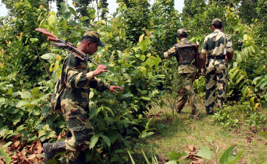 Indian paramilitary soldiers patrol inside a Maoist stronghold in the jungle bordering the village of Belpahari, some 120 miles west of Kolkata, India, on April 8, 2010.