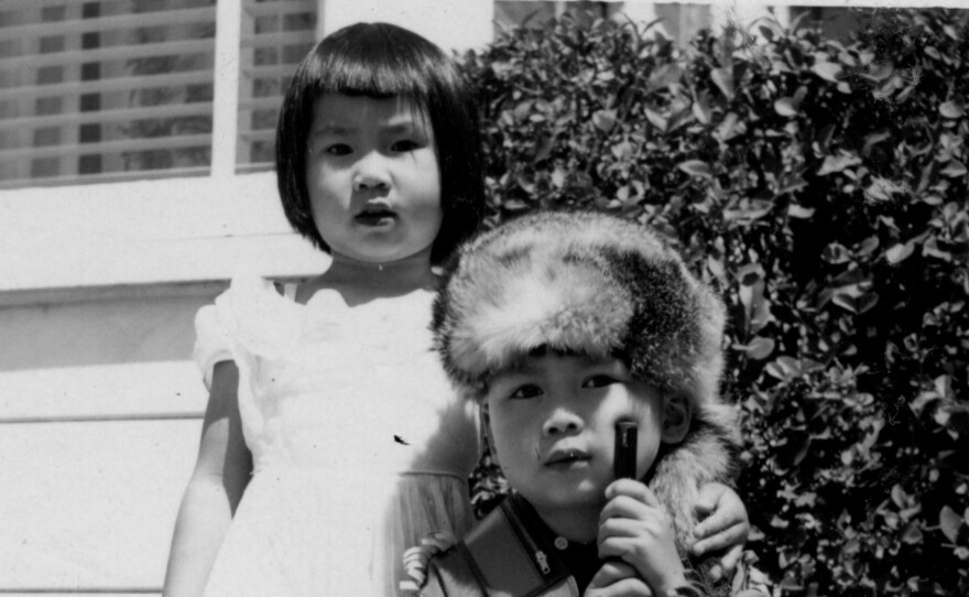 A 3-year-old Amy Tan appears with her brother Peter in this 1955 family photo. Peter died in 1967 after being diagnosed with a brain tumor.