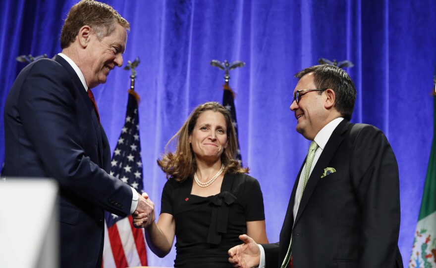 U.S. Trade Representative Robert Lighthizer (left) shakes hands with Canadian Foreign Affairs Minister Chrystia Freeland, accompanied by Mexico's Secretary of Economy Ildefonso Guajardo, after they spoke at a news conference Wednesday at the start of NAFTA renegotiations in Washington, D.C.
