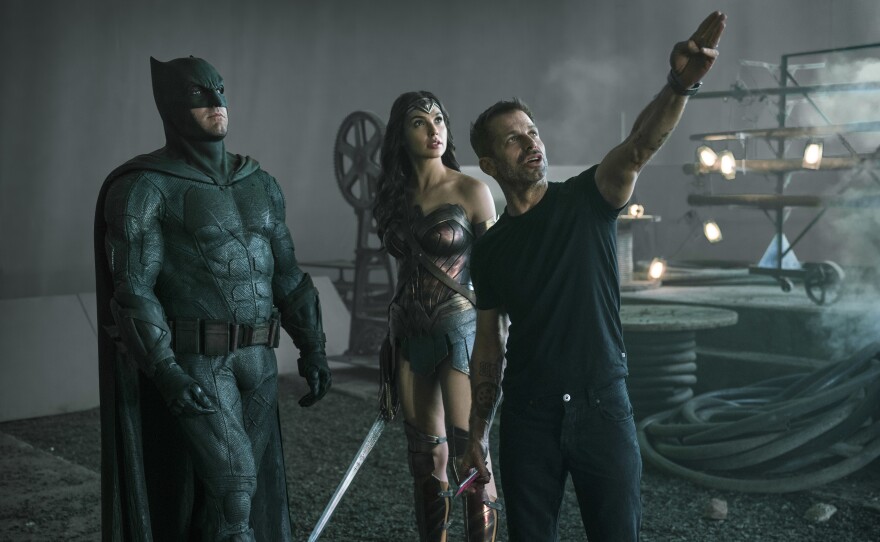 Zack Snyder directs Ben Affleck and Gal Gadot on the set of Justice League.