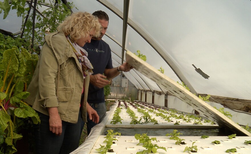 Host Nan Sterman and Chef Adam Navidi check out the aquaponic floating rafts in Brea, Calif.