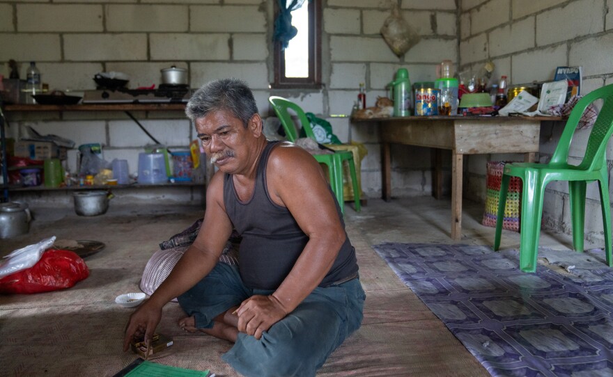 Pandi, 53, shares documents that show the struggle that local people have had with the construction of the new capital on their land.