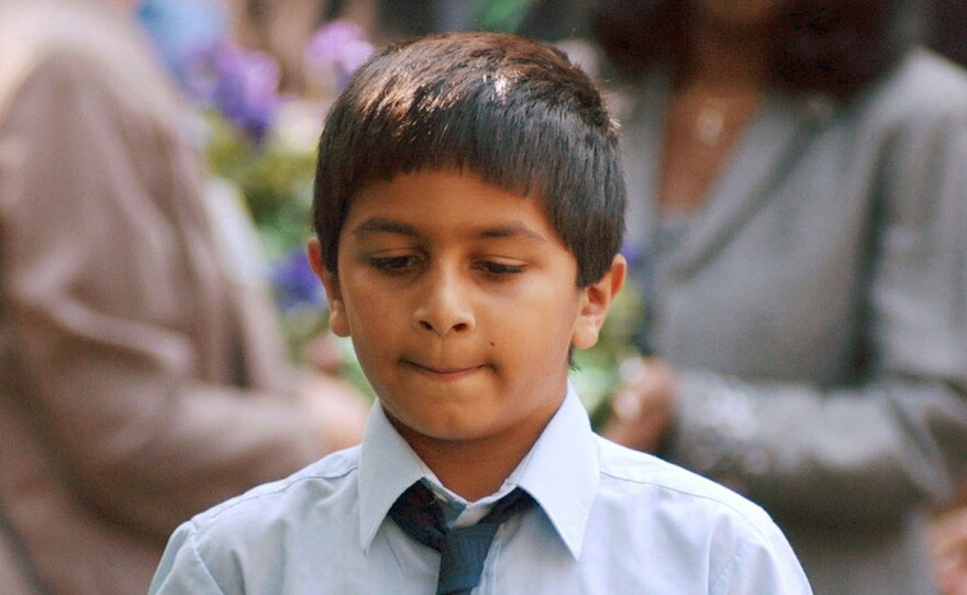 Robert Mathai was 8 years old when he lost his father, Joseph Mathai, a passenger on American Airlines Flight 11 when it crashed into the World Trade Center. In 2003, Robert, then 10, carried a pot of flowers to the site of a planned memorial in Boston. Today Mathai is a student at Tufts who recently traveled to Guantanamo Bay to witness court proceedings against the alleged Sept. 11 masterminds.