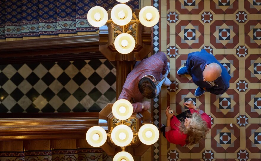 People chat together at the state Capitol in Sacramento on Sept. 12, 2025.
