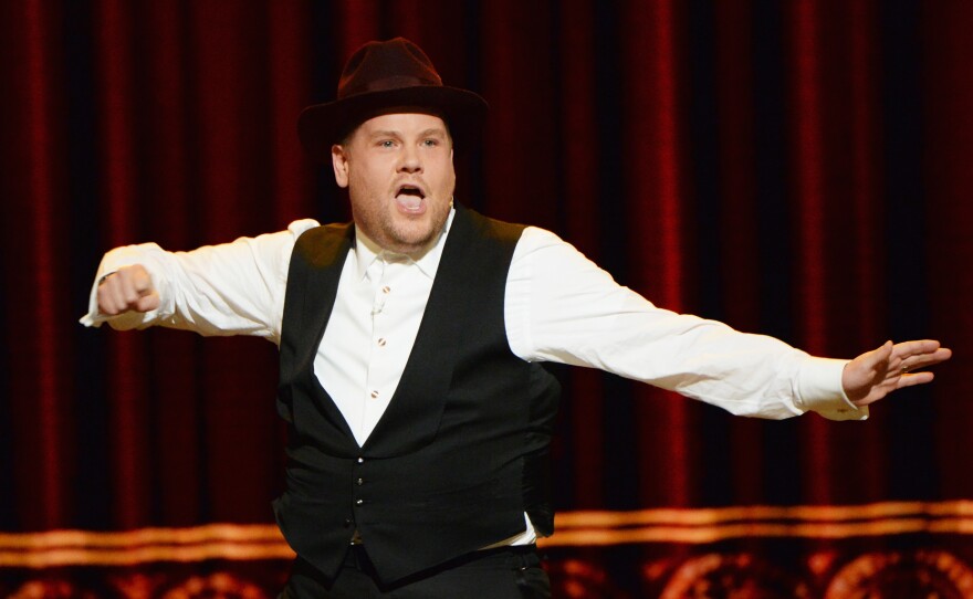 Host James Corden performs a "gleeful mashup of Broadway hits" during the opening number of the 70th Annual Tony Awards.