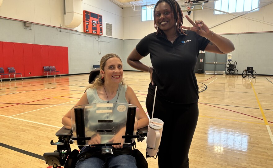 Stephanie Nichols Rodas and KPBS arts and culture reporter Audy McAfee after the Dynamic Inclusive Dance showcase fundraiser rehearsal in Park de La Cruz gym on Oct. 1, 2025.