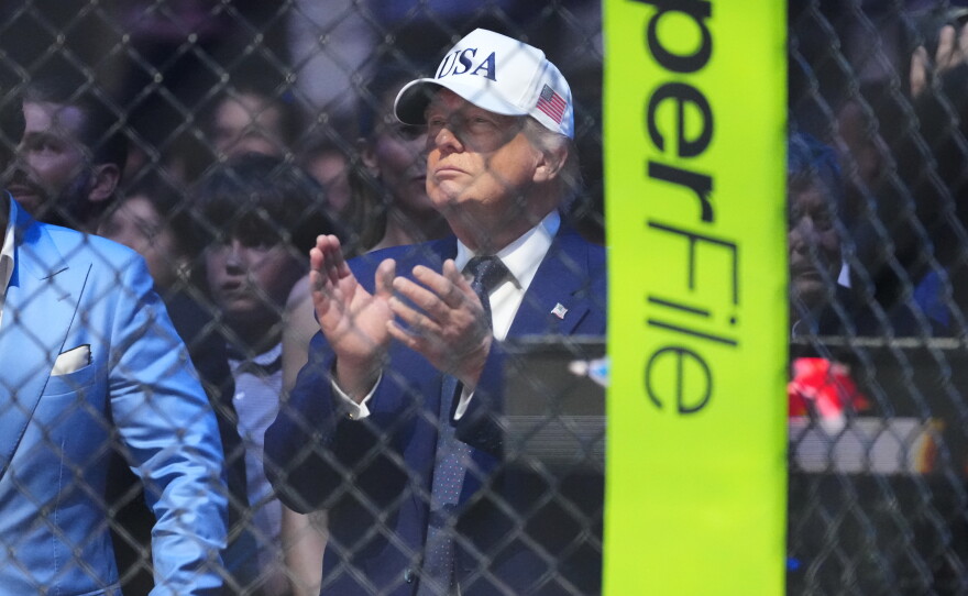 President Donald Trump applauds after Justin Gaethje defeated Ilia Toupruia in the lightweight championship bout at UFC Freedom 250 on the South Lawn of the White House, Monday, June 15, 2026, in Washington.