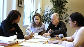 Gov. Jerry Brown reviews a measure with his wife, Anne Gust Brown, second from left, as staff members Camille Wagner, left, and Graciela Castillo-Krings, right, look on at his Capitol office, Sunday, Sept. 30, 2018, in Sacramento, Calif. 