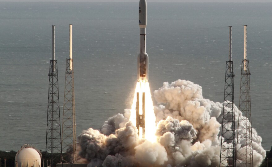 The rocket carrying NASA's Curiosity rover lifts off from Cape Canaveral, Fla., on Saturday morning.