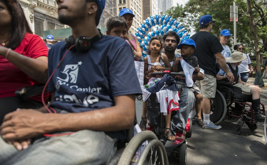 People take part in the first annual Disability Pride Parade in New York City on July 12, 2015.