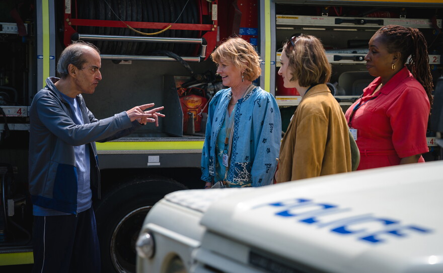 MASTERPIECE THE MARLOW MURDER CLUB, Season 3. Episode 2 "The Queen of Poisons: Part II". As the suspects’ secrets stack up, Judith, Becks and Suzie still can’t find anyone with a motive to hurt the Mayor. What are they missing? Shown L-R: Shown (L-R): Alec (Ranjit Krishnamma), Judith Potts (Samantha Bond), Becks Starling (Cara Horgan), Suzie Harris (Jo Martin)