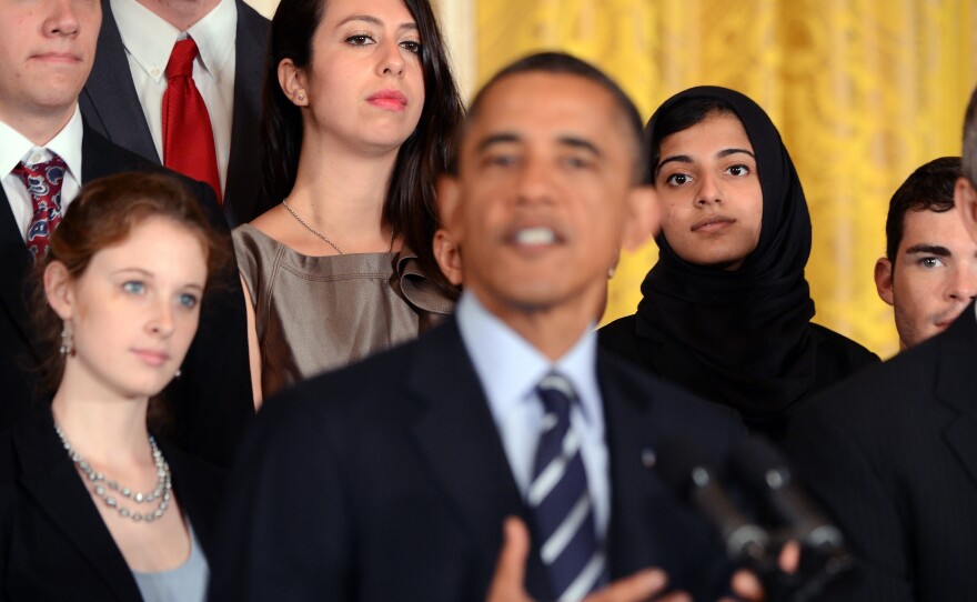 College students surrounded President Obama earlier this month when he called on Congress to stop student loan interest rates from doubling. Congress agreed on a deal to prevent the hike on Friday.