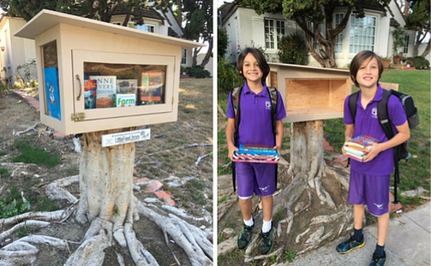 Jonah Figueroa, 10, and his brother Liam, 12, pose by their Little Free Library on 3019 Ibsen St.