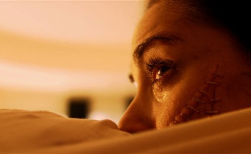 Ashley C. Williams has the unfortunate middle position in "The Human Centipede"