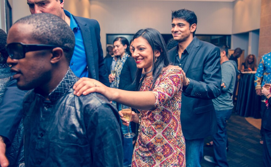 At the "Dinner in the Dark" restaurant that's just opened in Nairobi, a blind waiter leads guests to their table. The photo was taken during a training session — that's why the lights are on.