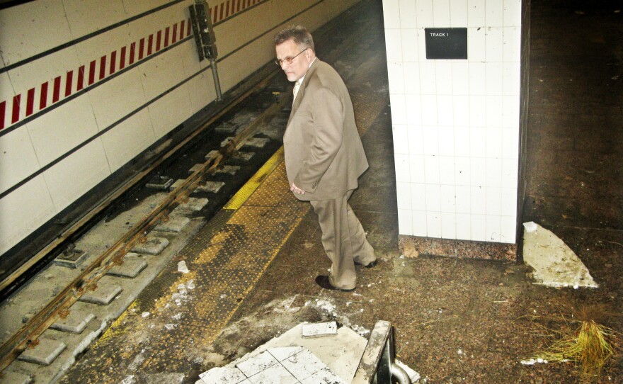 Joseph Leader, chief maintenance ofÃ¯iÂcer of the New York City subway system, surveys damage from Superstorm Sandy in the South Ferry station this week.