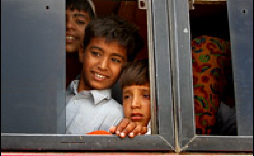 Children were among the 2 million people displaced by the Pakistan army's offensive against the Taliban in Swat Valley. These young residents of Jalozai camp crowd onto buses carrying their families for the trip home.