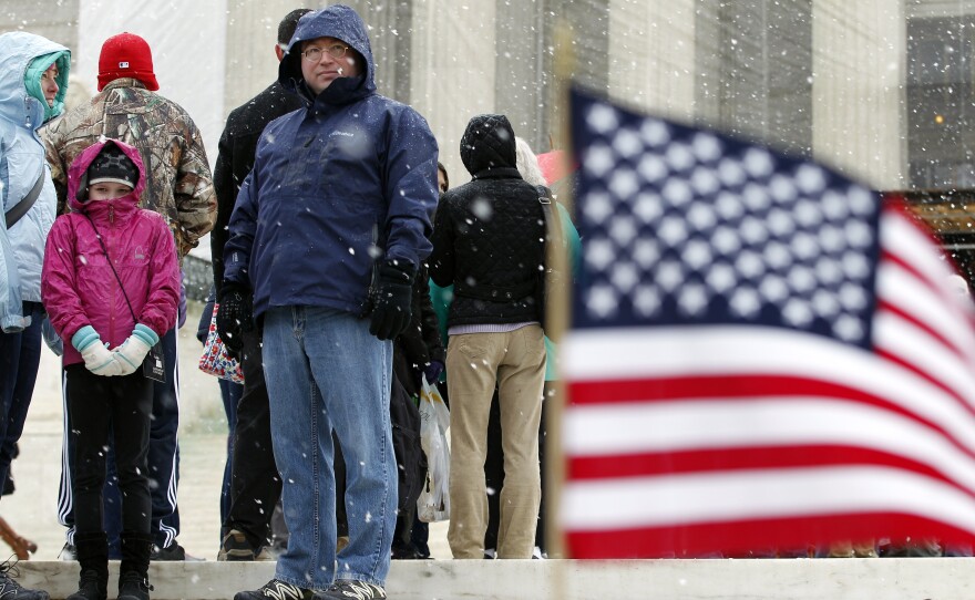 A scene outside the Supreme Court on Monday, as the justices announced they would hear another case involving affirmative action in higher education. Many of those waiting in line at the court in a late-season snowfall were hoping to attend oral arguments on gay-marriage cases being heard Tuesday and Wednesday.