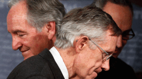 Majority Leader Harry Reid of Nevada passes fellow Democratic Sens. Tom Harkin of Iowa (left) and Charles Schumer of New York (right) while leaving a news conference this week on Capitol Hill.