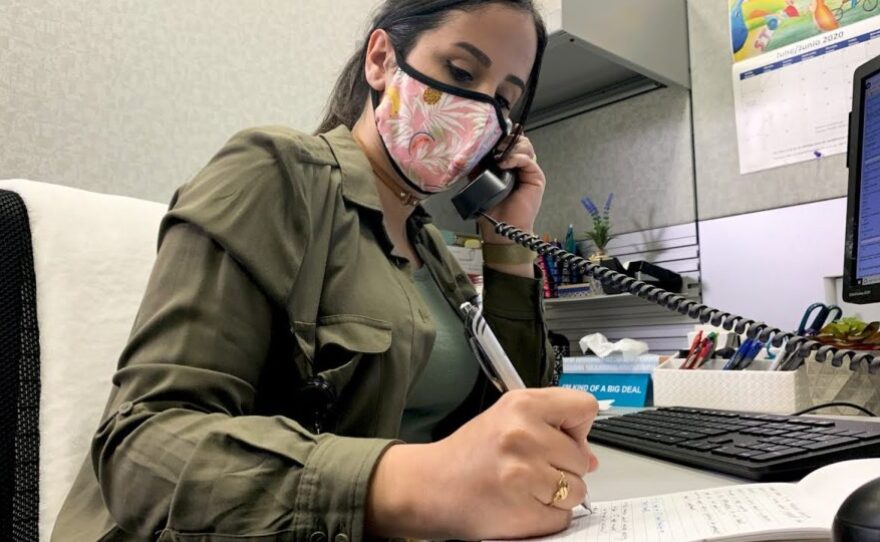 Asma Al Sabag, a contact tracer for San Diego County, makes phone calls in this undated photo.