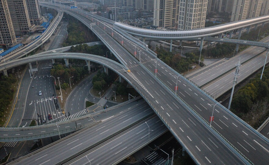 Roads are empty in Wuhan, where public transit has been shut down and residents are restricted in their excursions.