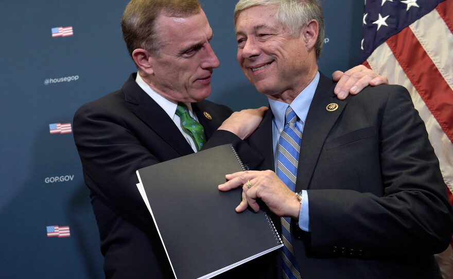 Rep. Tim Murphy, R-Pa., embraces Rep. Fred Upton, R-Mich., during a media briefing about the 21st Century Cures Act on Capitol Hill on Nov. 30.