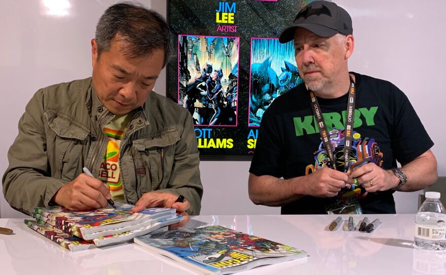 Artist and Chief Creative Officer of DC Comics Jim Lee and Inker/Colorist Scott Williams sign books at Comic-Con, July 20, 2019. 