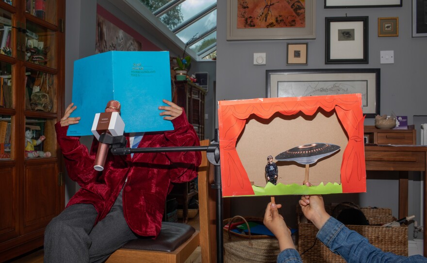 Dalziel and her sons created a stage out of a cereal box and the boys performed puppet productions of children's books and a play penned by her eldest son: "Aliens in the Field" tells a story of aliens landing on his school grounds.