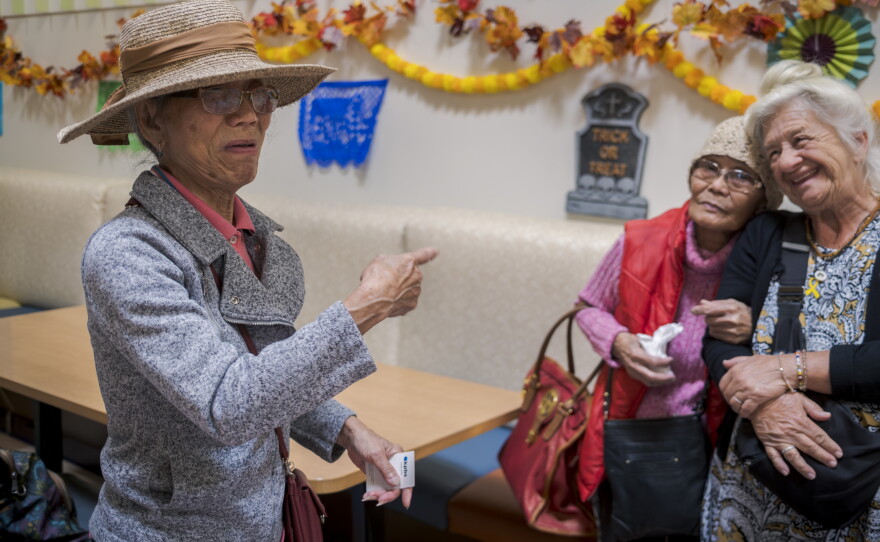 86-year-old Mary Eastwood (left) travels from El Cajon to Serving Seniors in downtown San Diego to have lunch with her sister, Elena Batesting, 94 and a friend on Nov. 5, 2025.