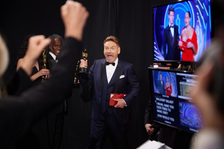 Kenneth Branagh poses backstage with the Oscar® for Original Screenplay. March 27, 2022.