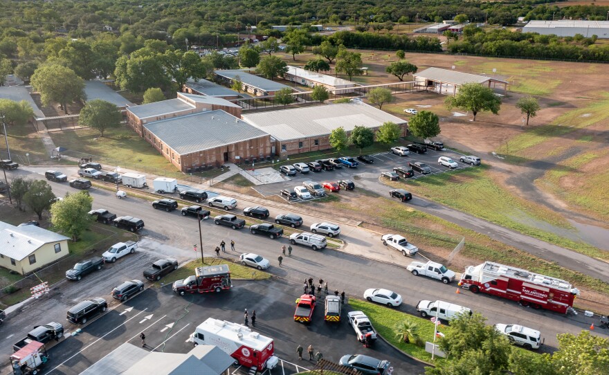 Law enforcement officers work on Wednesday at Robb Elementary School, the site of Tuesday's mass shooting in Uvalde, Texas.