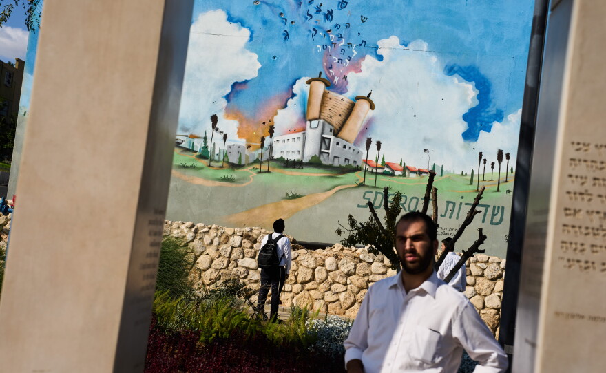 People visit a memorial at a police station attacked by Hamas on Oct. 7, 2023, three years prior, in Sderot, southern Israel, on Oct. 4.