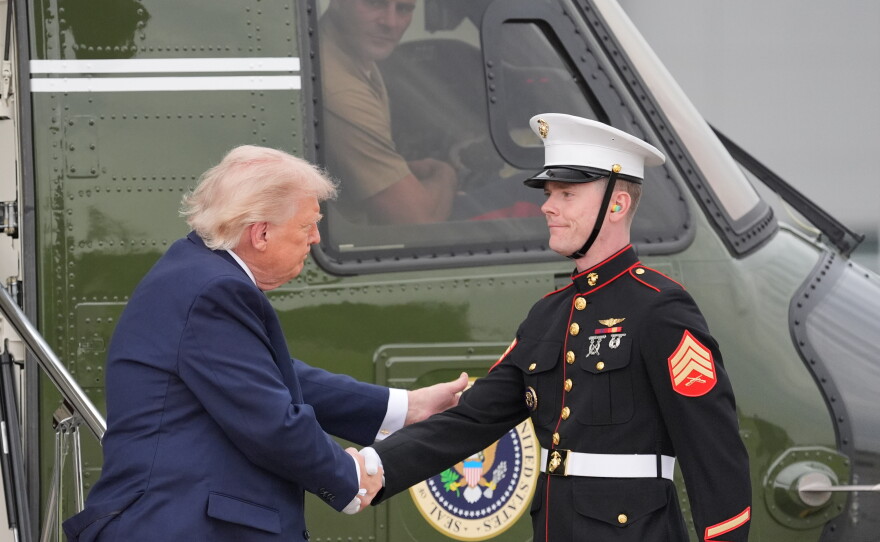 President Donald Trump shakes hands with a member of the U.S. Marine Corps as he arrives on Marine One to board Air Force One at Morristown Airport, Friday, May 22, 2026, in Morristown, N.J.