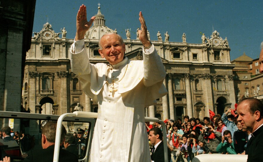 Pope John Paul II waves to the faithful during his general audience in St. Peter's Square on March 29, 1989. Archbishop Timothy Dolan says "there was something mystical, there was something transcendent, there was something unique" about the late pope.