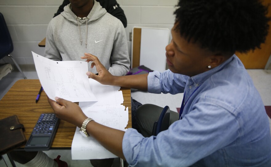 Johnson tutors students in math at Lafayette High School in Oxford.