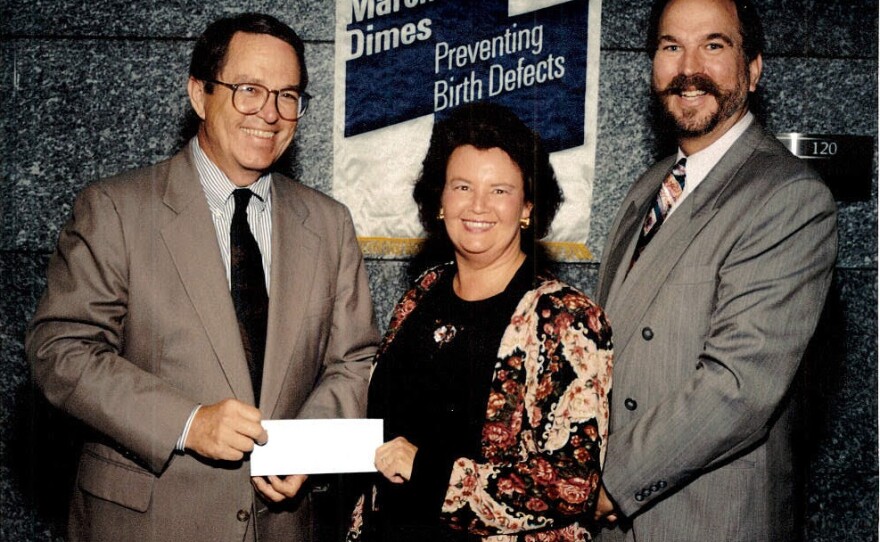 Cunningham, on behalf of the San Ysidro Health Center, accepts gift from the March of Dimes.