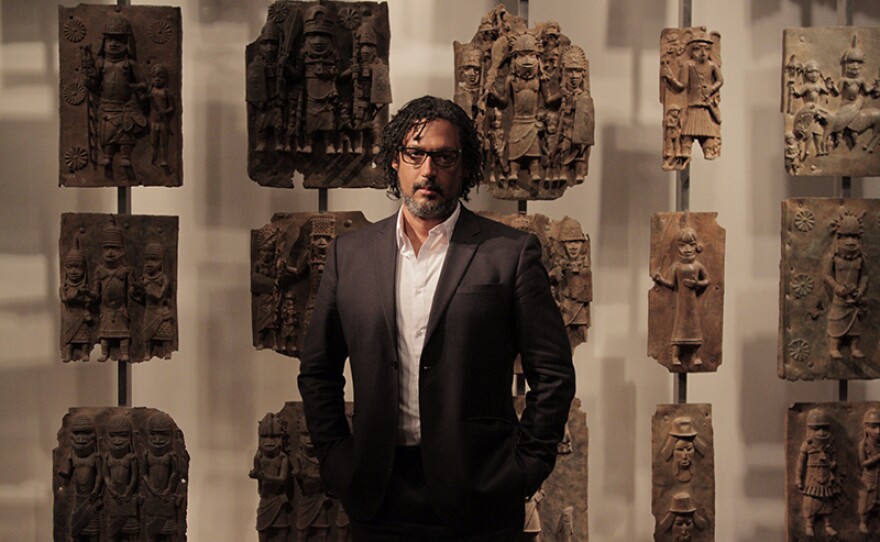 Presenter David Olusoga with various Benin Bronzes, Unknown Artist (c. 1550 – 1650) – British Museum, London.