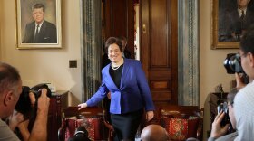 Supreme Court nominee Elena Kagan walks in to meet with Senate Majority Leader Sen. Harry Reid (D-NV) while making the rounds at the U.S. Capitol in May.