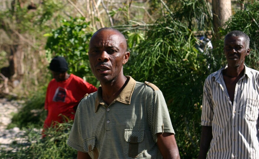 Pastor Louis Masil is trying to make the case that his village should be getting assistance even if the damage there wasn't the worst.