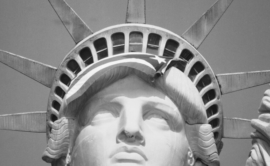 The Puerto Rican flag is draped across the crown of the Statue of Liberty on Oct. 25, 1977, after demonstrators occupied the monument.