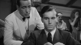 A screenshot from <em>Casablanca</em> showing Humphrey Bogart and Helmut Dantine.