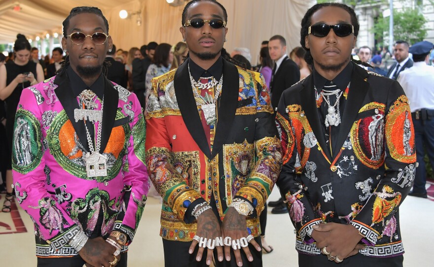 Rappers Offset (from left), Quavo and Takeoff of the group Migos appear at a Met gala in 2018. Kirshnik Khari Ball, known professionally as Takeoff, died early Tuesday morning after gunshots were fired at a party in Houston.