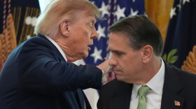 President Donald Trump walks past Attorney General Todd Blanche after speaking at a roundtable event in the East Room of the White House, Wednesday, Oct. 21, 2026, in Washington.