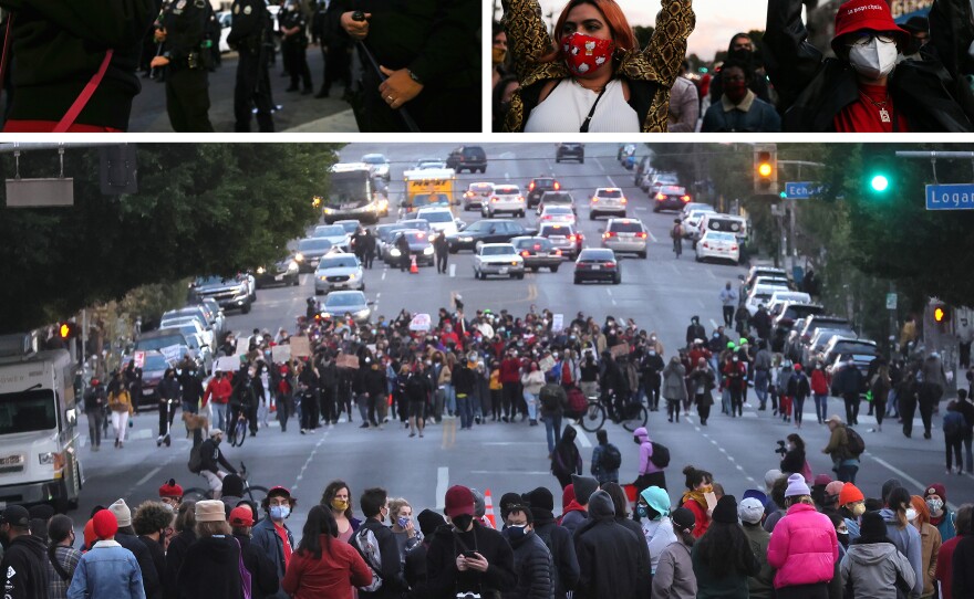 Protesters demonstrate on Sunset Boulevard against the removal of a homeless encampment at Echo Park Lake on March 25, 2021.