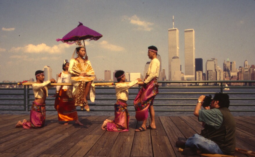 A Thai dance troupe performs with the World Trade Center in the background in the 1980s. (New York)