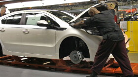 Workers assemble a Chevrolet Volt at GM's Detroit Hamtramck Assembly Plant in October. The auto maker says it will idle the plant for five weeks, to allow demand to catch up with inventory.