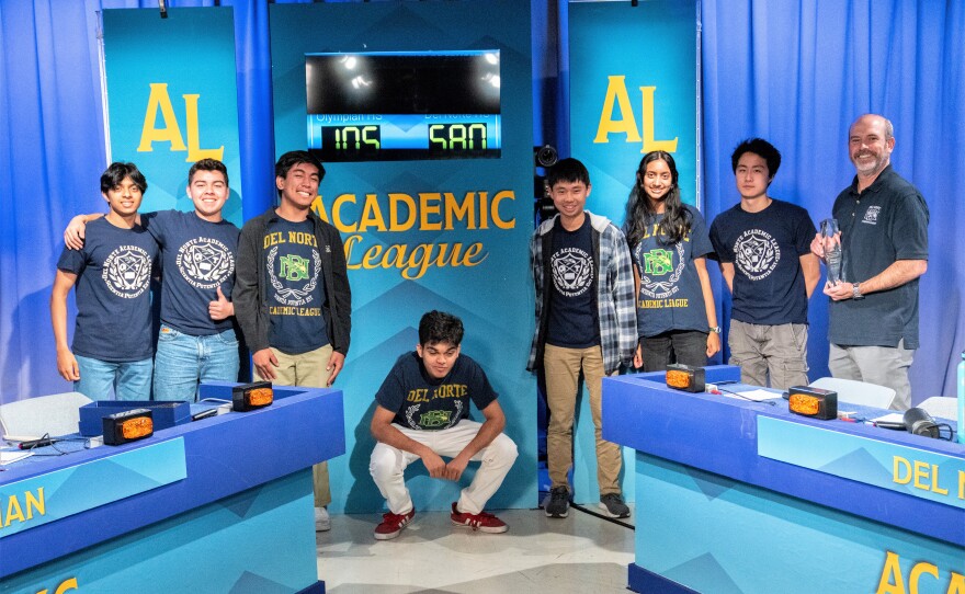 Del Norte High School coach Tom Swanson (far right holding trophy) stands with his Academmic League championship students, San Diego, Calif., May 2, 2023.