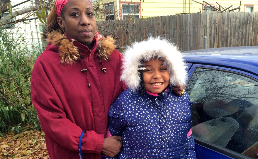 Angel Hinton with her daughter, Cameisha, 8. Hinton's business suffered after her license was suspended.