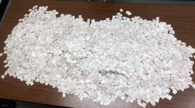 Packets of heroin sit on a desk, Jan. 20, 2015.